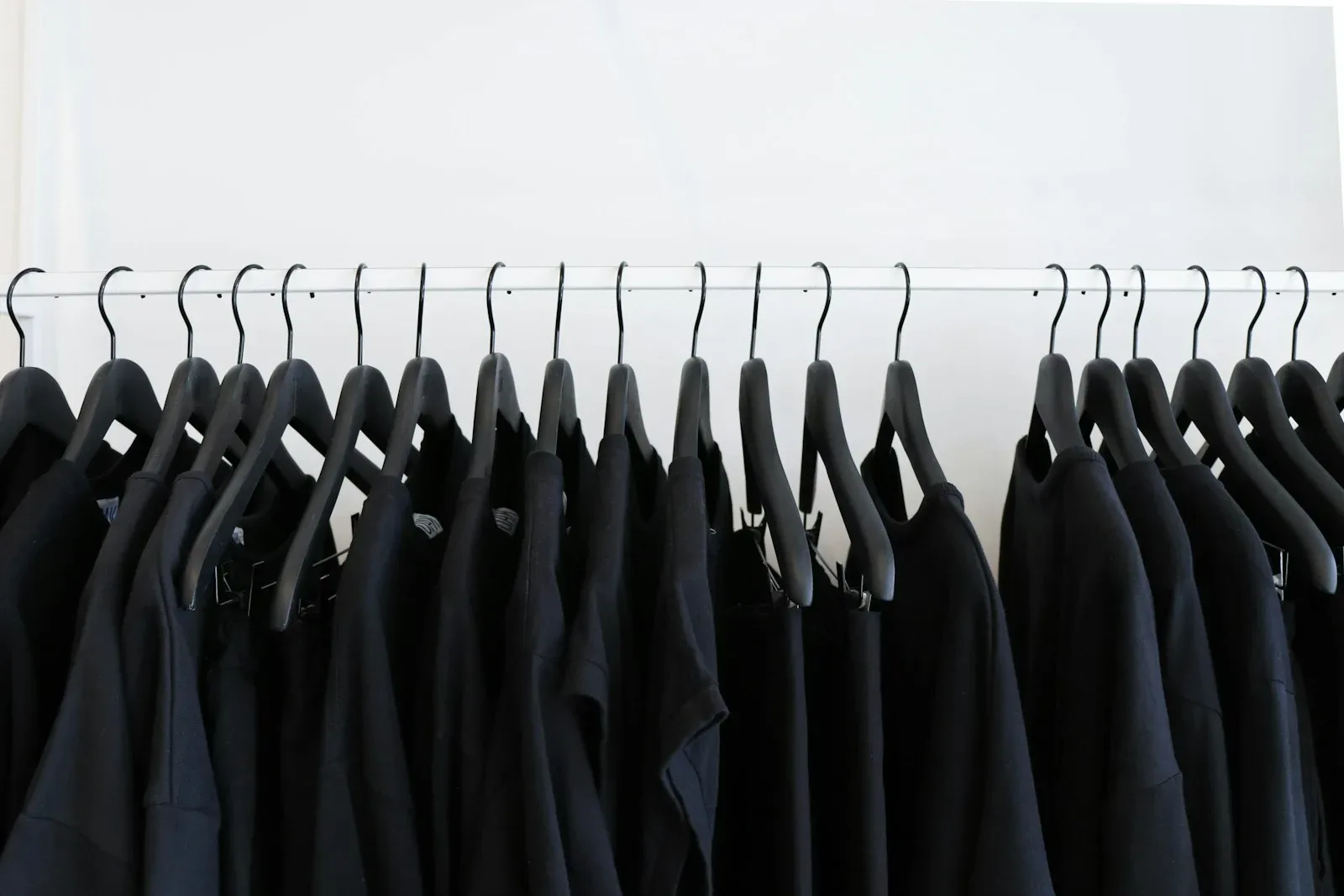 Premium black apparel collection on hangers